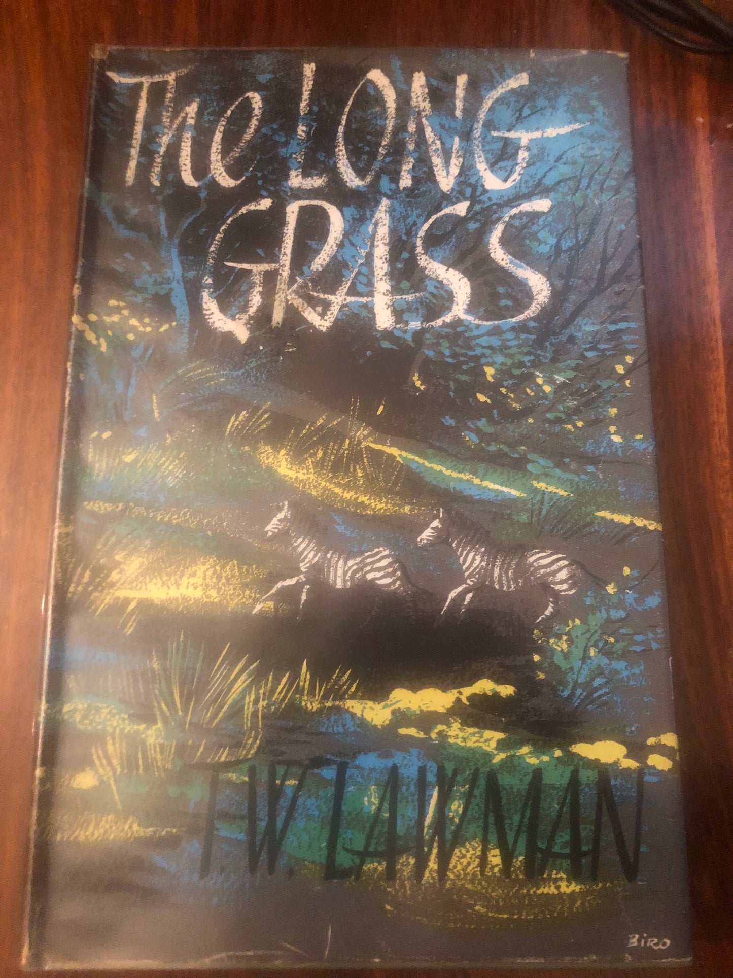 The Long Grass by T. W. Lawman, published in 1958 by Robert Hale Limited in London